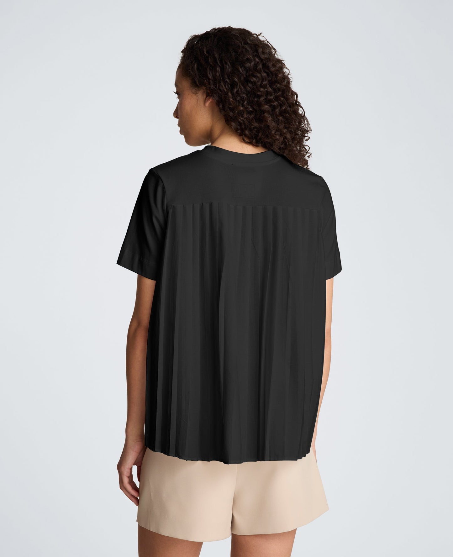 Short Sleeve Crewneck Tee with Pleated Asymmetrical Hem